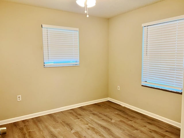 spare room featuring hardwood / wood-style floors