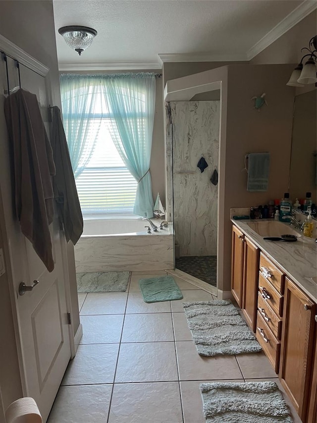 bathroom featuring independent shower and bath, a textured ceiling, tile patterned floors, vanity, and ornamental molding