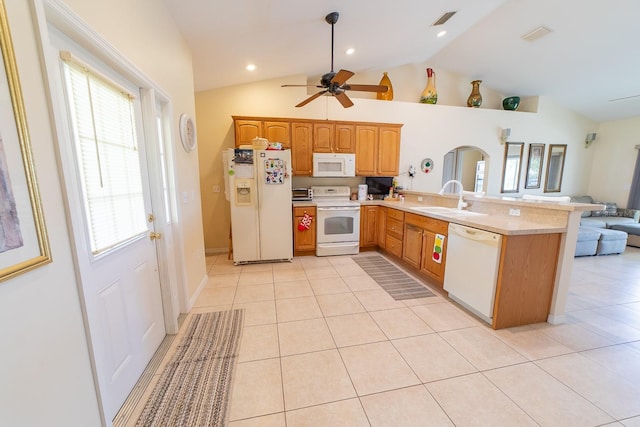 kitchen with sink, vaulted ceiling, kitchen peninsula, and white appliances