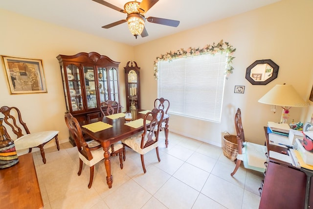 tiled dining room with ceiling fan