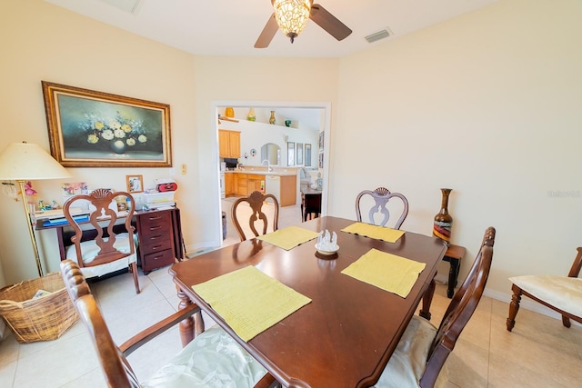 dining room featuring sink, ceiling fan, and light tile patterned flooring