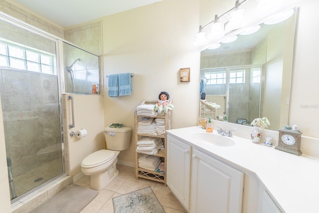 bathroom with vanity, a shower with shower door, toilet, and tile patterned flooring