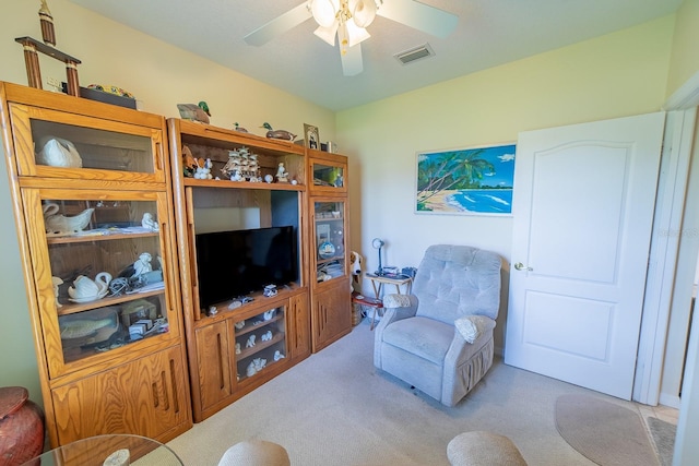 living room with ceiling fan and light carpet