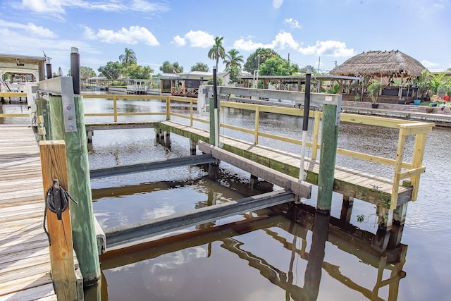 dock area with a gazebo and a water view