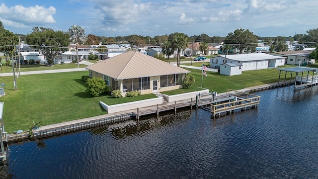 exterior space featuring a water view and a lawn