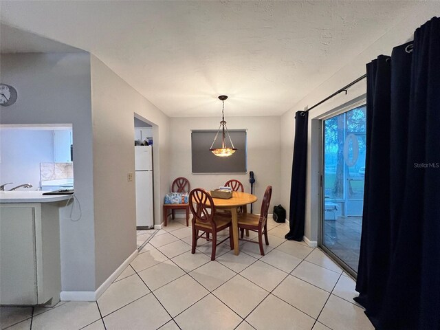 3124 US Highway 441 SE Unit I-4, Okeechobee, FL 34974 - dining space with baseboards and light tile patterned floors