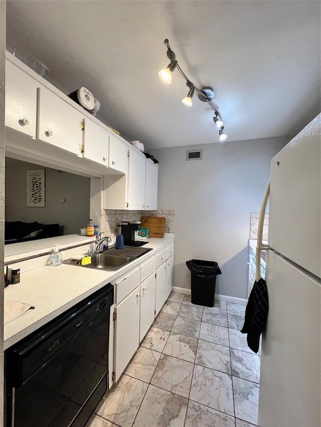 3124 US Highway 441 SE Unit I-4, Okeechobee, FL 34974 - kitchen featuring freestanding refrigerator, a sink, black dishwasher, light marble finish flooring, and light countertops