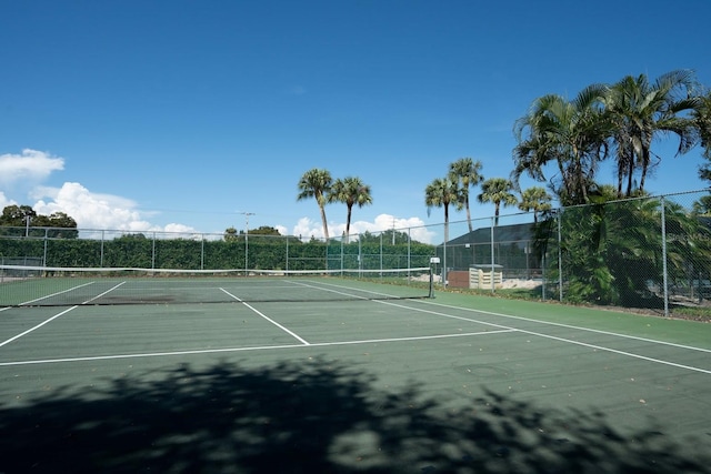 view of tennis court with a mountain view