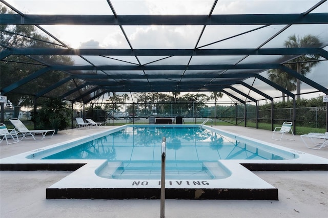 3124 US Highway 441 SE Unit I-4, Okeechobee, FL 34974 - outdoor pool with a patio and glass enclosure