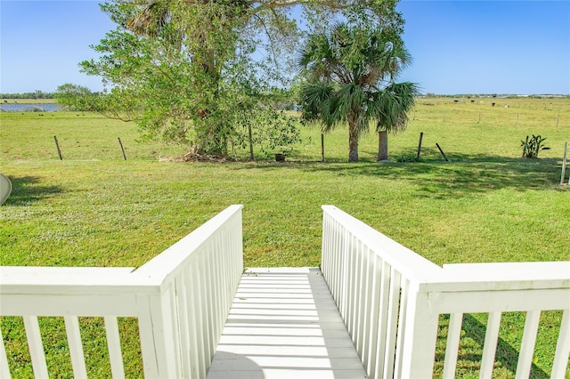 view of yard featuring a water view and a rural view