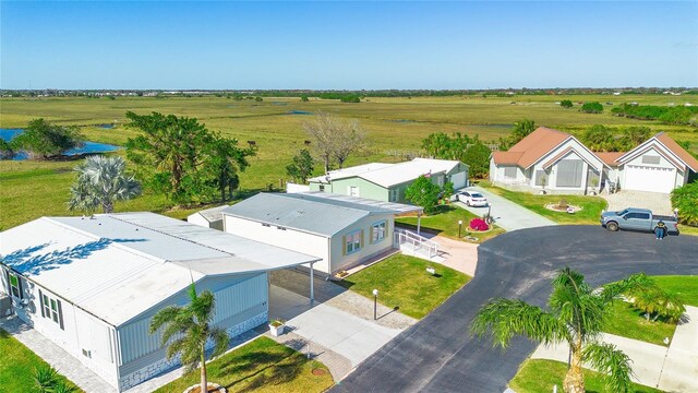 birds eye view of property featuring a rural view