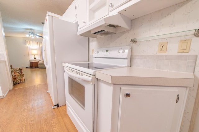 kitchen with white cabinets, electric range, ceiling fan, light wood-type flooring, and a textured ceiling