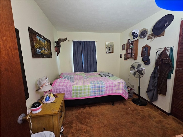 bedroom with dark carpet