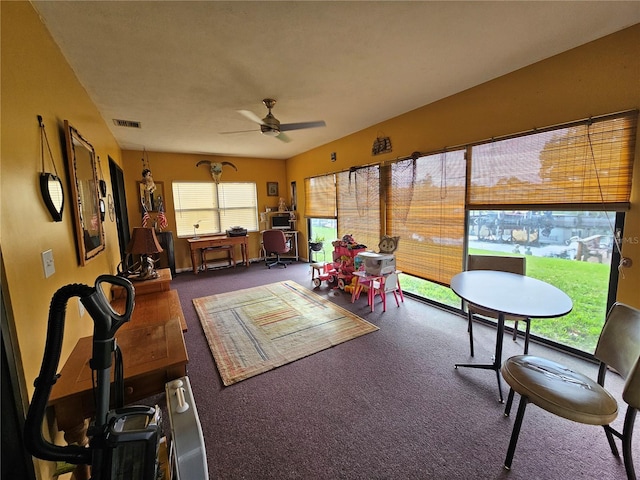 sunroom / solarium featuring ceiling fan and plenty of natural light