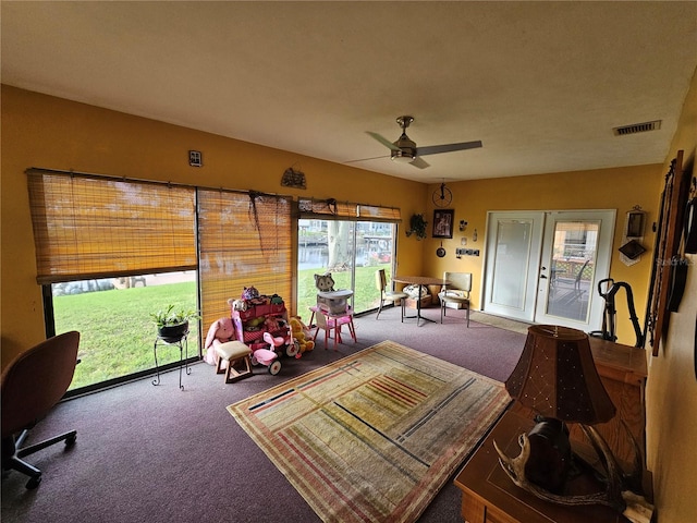 sunroom featuring ceiling fan