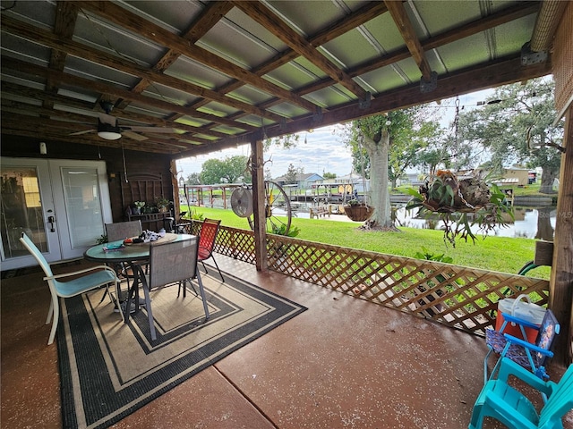 view of patio / terrace featuring ceiling fan and a water view