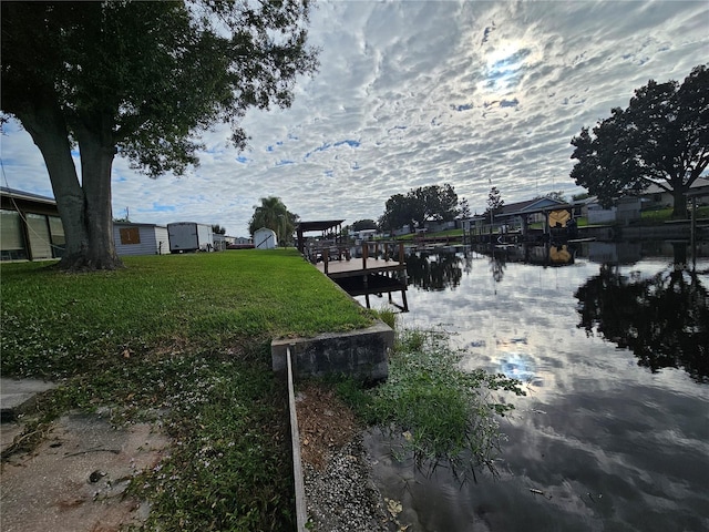 property view of water with a dock