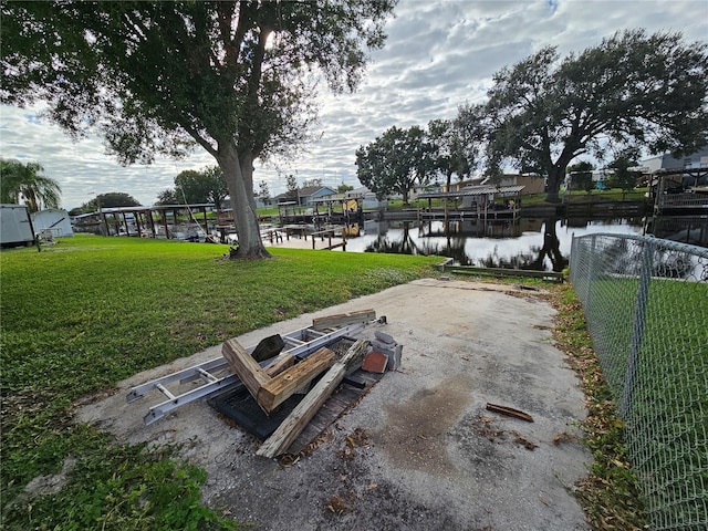 exterior space featuring a water view and a yard