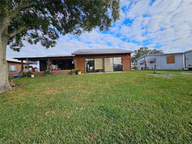 back of house with a yard