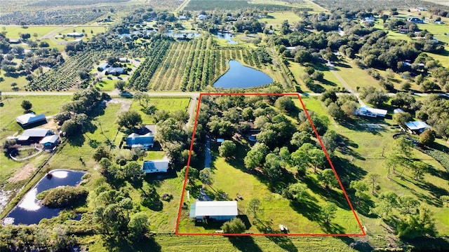 bird's eye view with a rural view and a water view