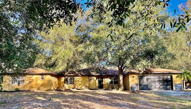 single story home with a garage