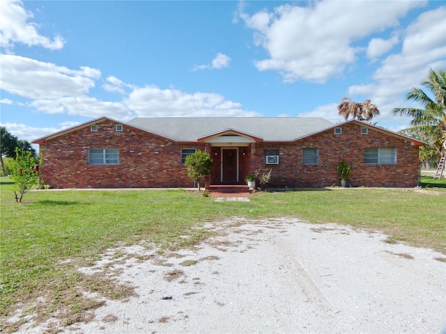 ranch-style home with a front yard