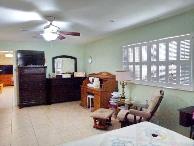 bedroom with ceiling fan and light tile patterned flooring