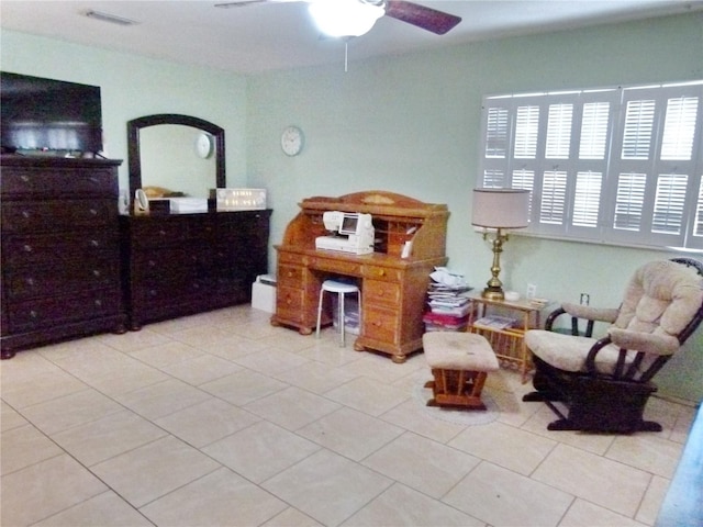 living area featuring ceiling fan and light tile patterned flooring