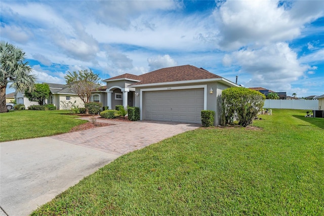 view of front facade with a garage and a front yard