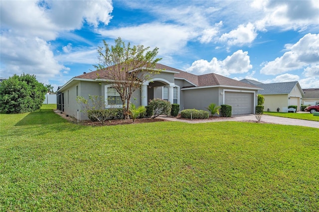 single story home featuring a garage and a front lawn