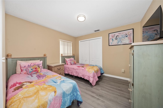 bedroom featuring a closet and hardwood / wood-style floors