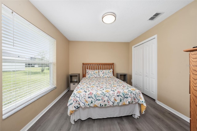 bedroom featuring a closet and dark hardwood / wood-style floors