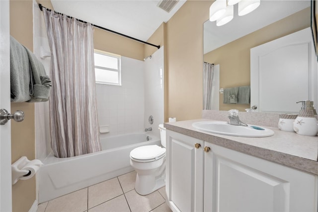 full bathroom with tile patterned floors, shower / tub combo with curtain, vanity, and toilet