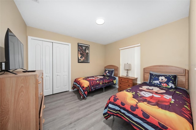 bedroom featuring a closet and light hardwood / wood-style flooring