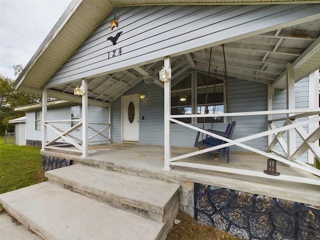 doorway to property with covered porch