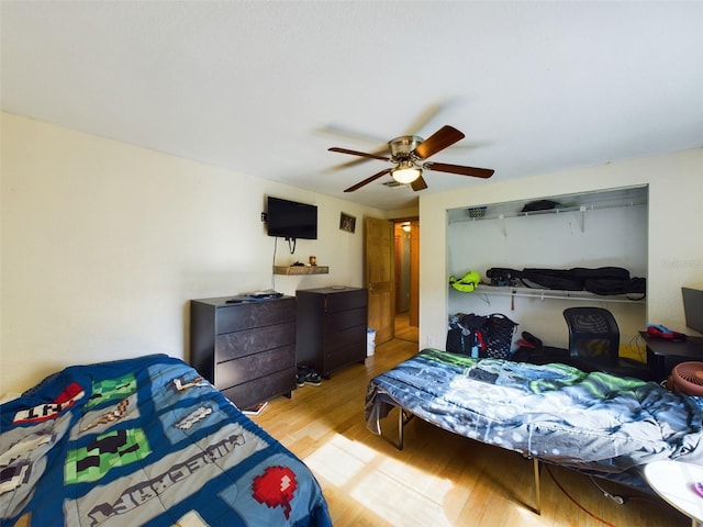 bedroom featuring ceiling fan and light hardwood / wood-style floors