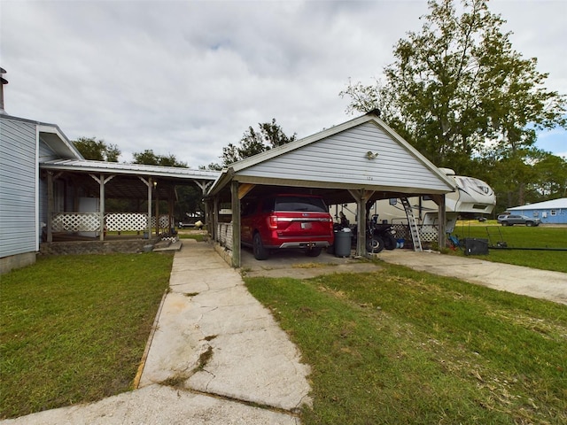 exterior space with a lawn and a carport