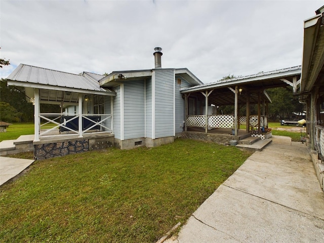 exterior space featuring a lawn and a porch