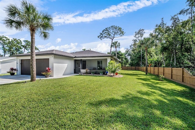 exterior space featuring a front lawn and a garage