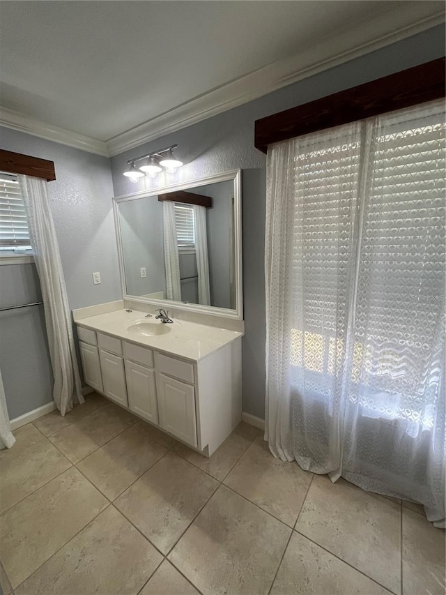 bathroom with vanity, tile patterned floors, and crown molding