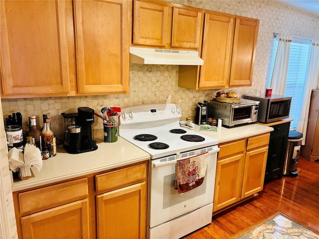 kitchen with backsplash, dark hardwood / wood-style floors, and white electric stove