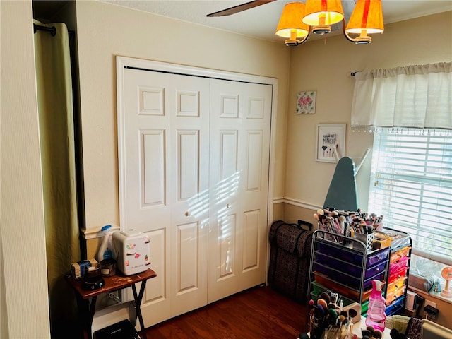 game room with ceiling fan and dark hardwood / wood-style flooring