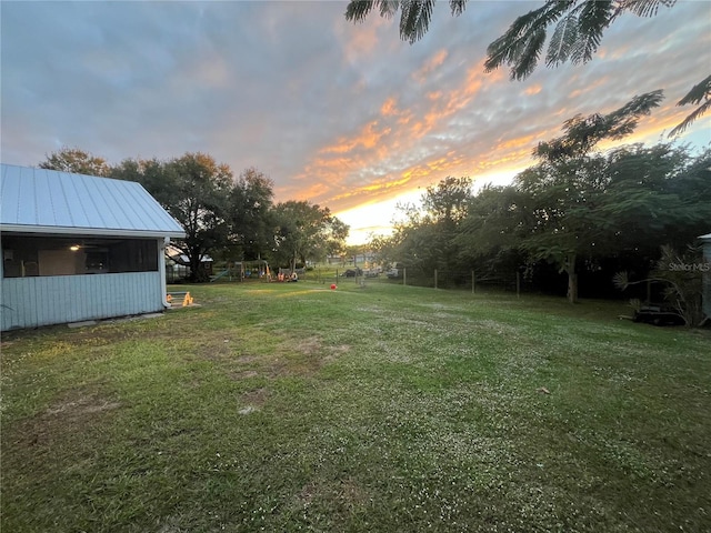 view of yard at dusk