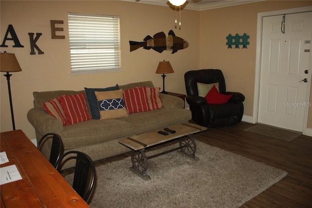 living room featuring ceiling fan, dark hardwood / wood-style floors, and ornamental molding