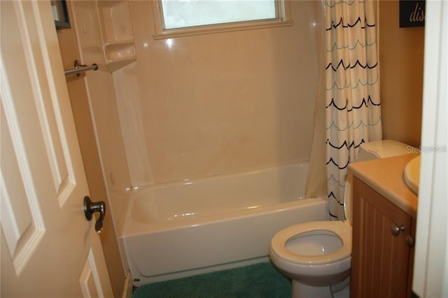 full bathroom with shower / bath combo, toilet, and vanity