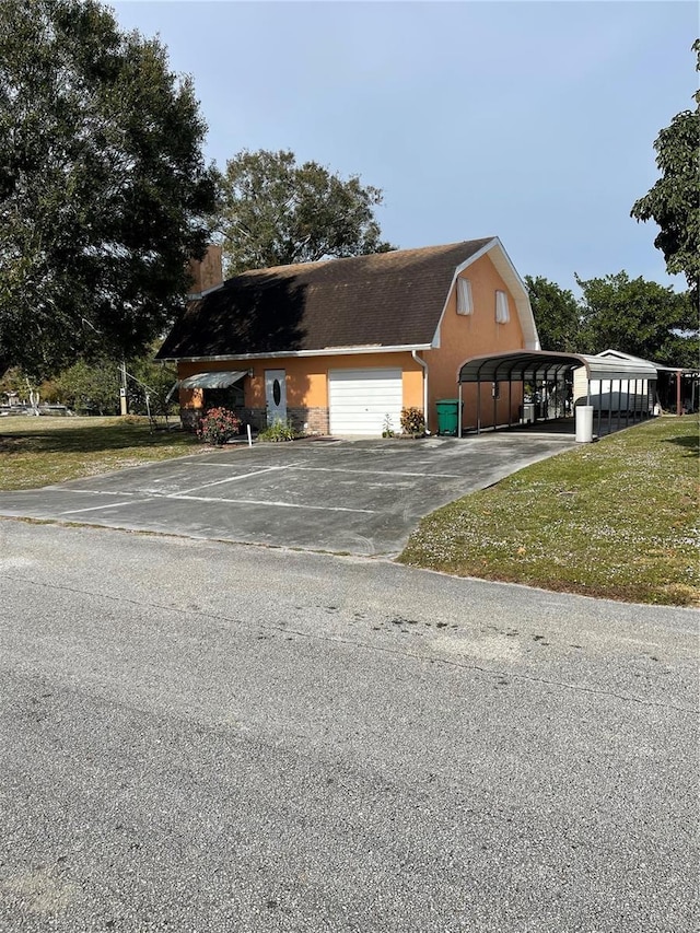 exterior space featuring a carport, a garage, and a lawn