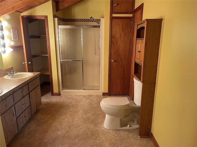 bathroom with vanity, toilet, and walk in shower