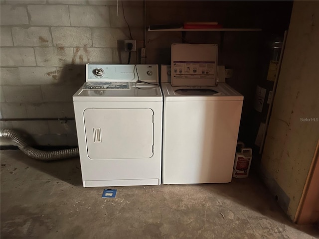 laundry area featuring washing machine and clothes dryer