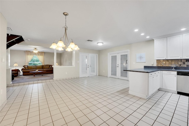 kitchen featuring white cabinetry, dishwasher, french doors, hanging light fixtures, and light tile patterned floors