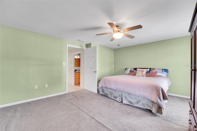 bedroom with ceiling fan and light colored carpet